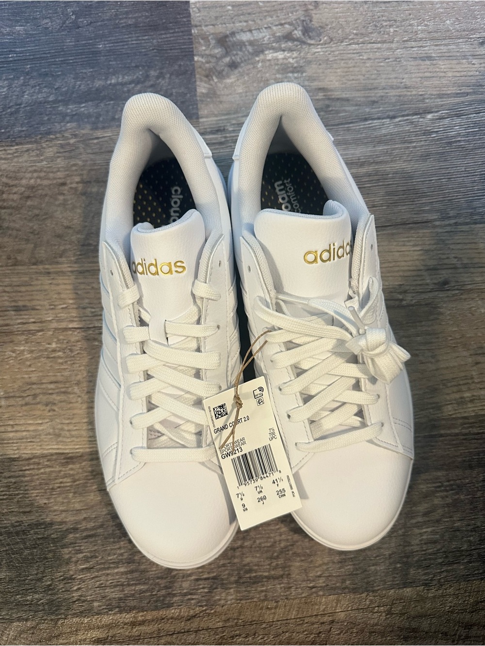 Adidas Women’s White Sneakers with Gold Logo Accents